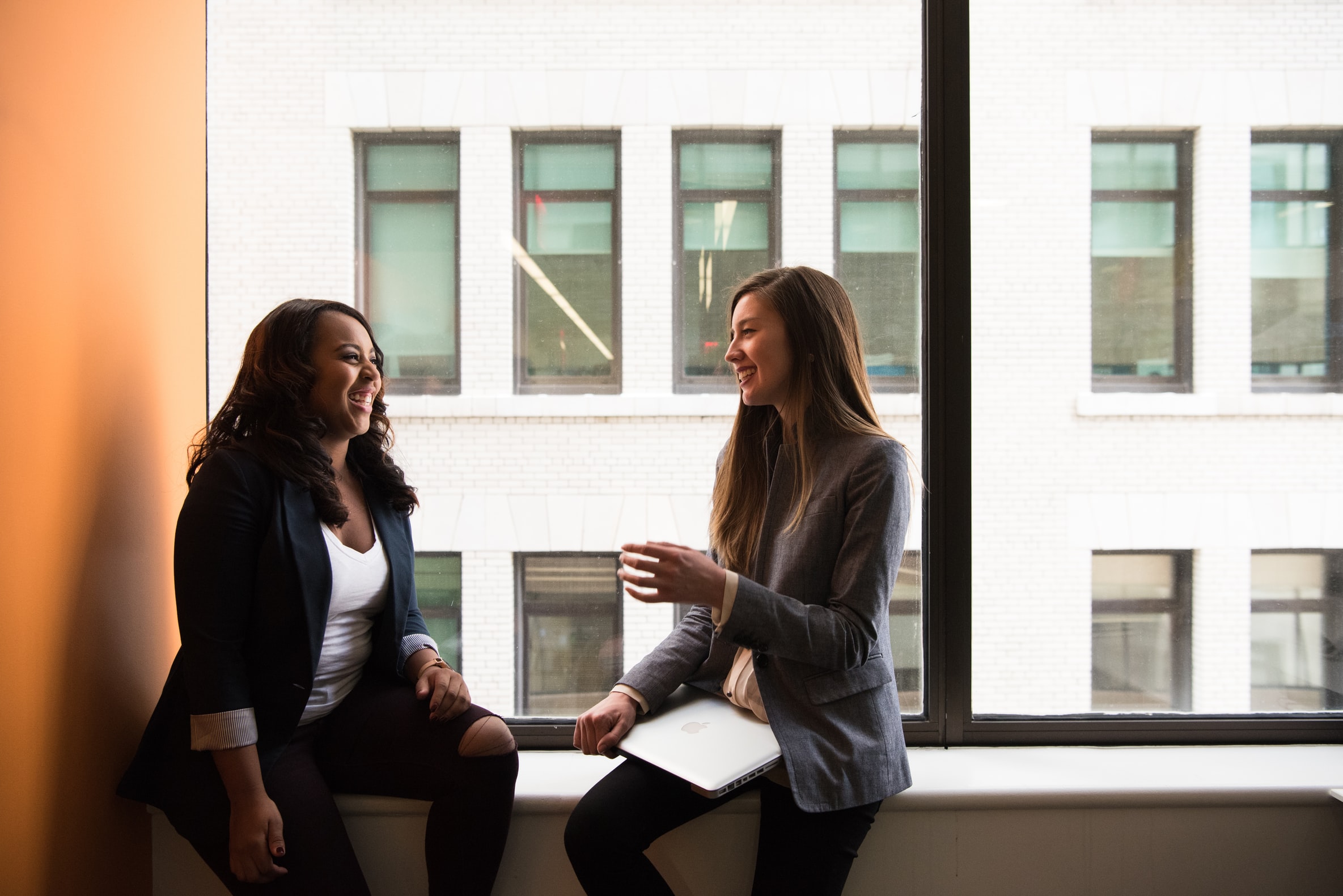 women talking in window