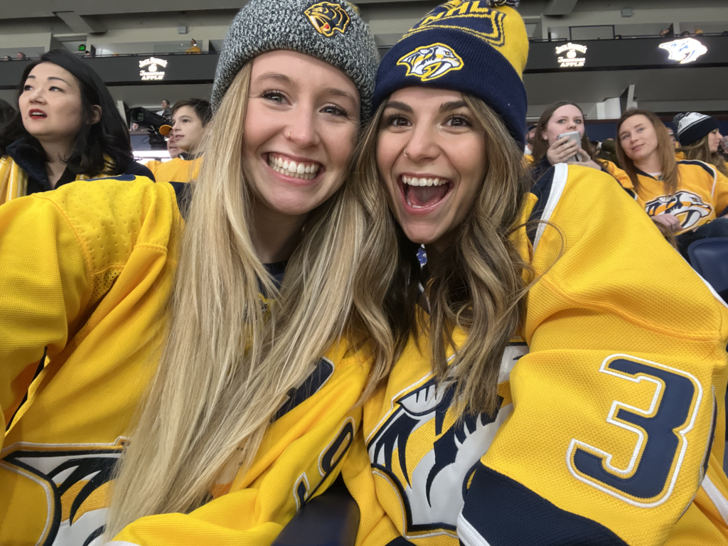 Madyson (left) with her friend, Jiana, doing one of her favorite things - cheering on the Nashville predators live.